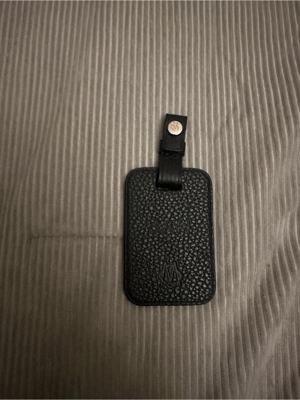 Rimowa black bookbag tag
